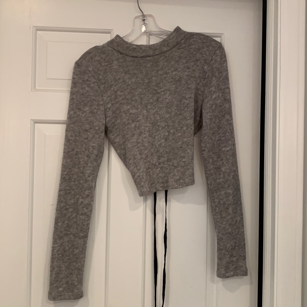 Gray cropped sweater with black lace up in back